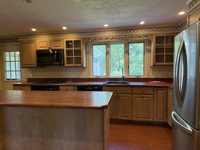 6 J William Hts, Millis, MA 02054 - kitchen featuring black appliances, wood counters, decorative backsplash, glass insert cabinets, and recessed lighting