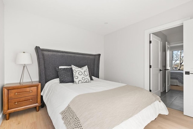 bedroom with wood finished floors