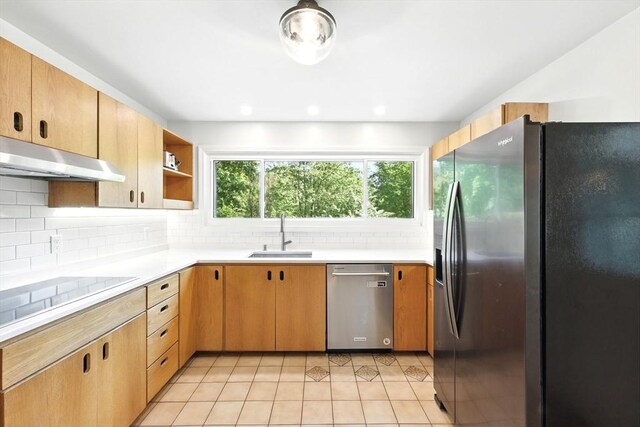 2 Silverwood Ter, South Hadley, MA 01075 - kitchen featuring stainless steel appliances, a sink, under cabinet range hood, light tile patterned flooring, and light countertops
