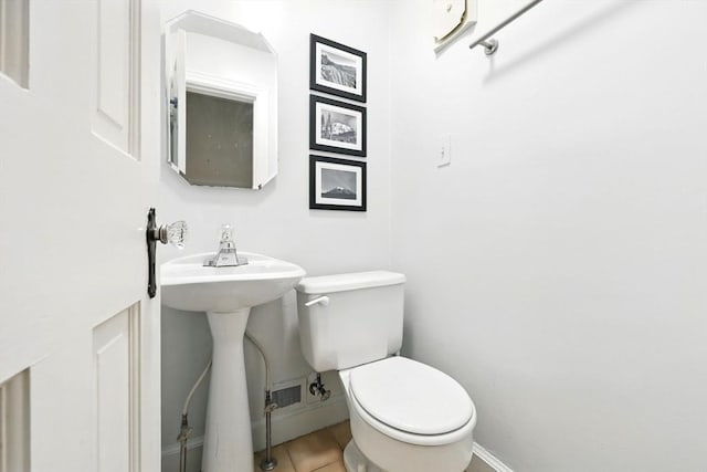 2 Silverwood Ter, South Hadley, MA 01075 - half bathroom with toilet, tile patterned floors, baseboards, and a sink