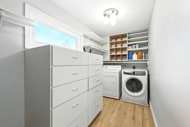 2 Silverwood Ter, South Hadley, MA 01075 - laundry area with washer and dryer and light wood-style floors