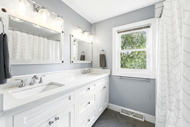 2 Silverwood Ter, South Hadley, MA 01075 - full bath featuring baseboards and double vanity