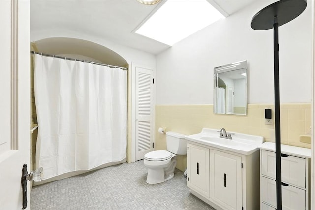 2 Silverwood Ter, South Hadley, MA 01075 - full bath featuring tile walls, vanity, wainscoting, toilet, and tile patterned floors
