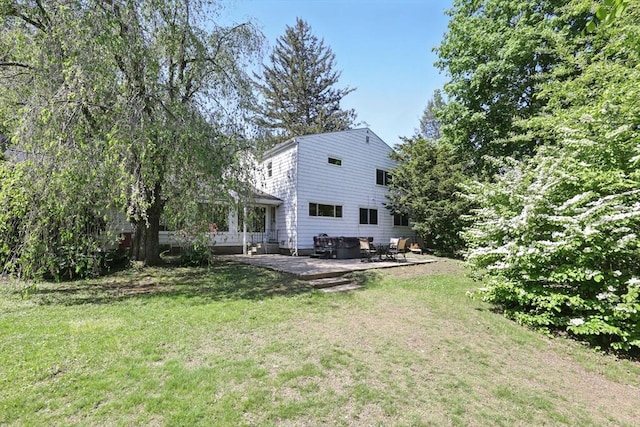 2 Silverwood Ter, South Hadley, MA 01075 - rear view of property with a patio and a lawn