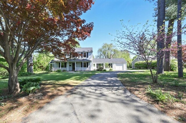 2 Silverwood Ter, South Hadley, MA 01075 - view of front of home featuring asphalt driveway, a porch, a garage, and a front yard