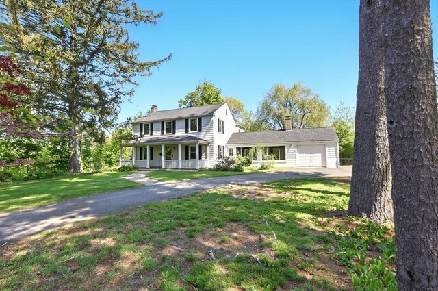 2 Silverwood Ter, South Hadley, MA 01075 - view of front of property with a chimney, covered porch, an attached garage, and driveway