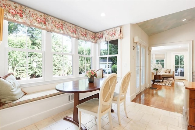 dining room featuring recessed lighting, visible vents, and vaulted ceiling