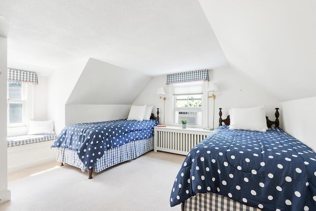 carpeted bedroom featuring cooling unit, radiator, and vaulted ceiling