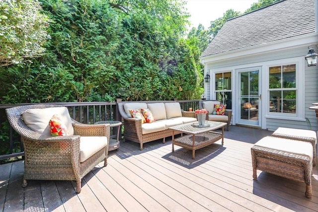 wooden terrace with an outdoor hangout area