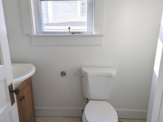 12-14 Essex St, Dover, NH 03820 - bathroom featuring baseboards, toilet, and vanity