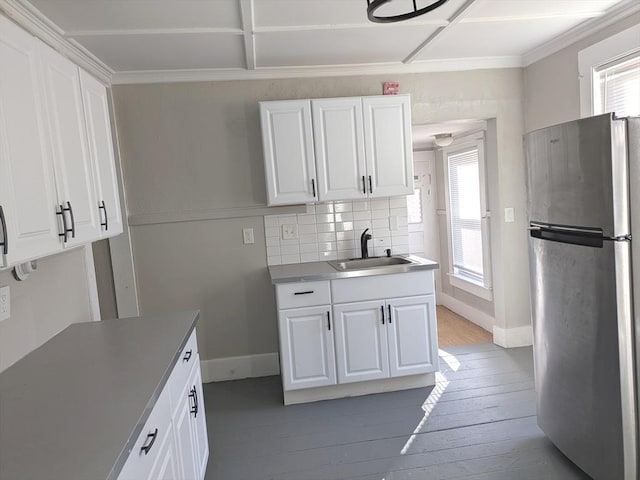 12-14 Essex St, Dover, NH 03820 - kitchen featuring freestanding refrigerator, a sink, healthy amount of natural light, wood-type flooring, and ornamental molding