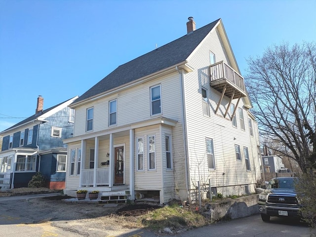 12-14 Essex St, Dover, NH 03820 - view of front of property with a porch, a chimney, and a balcony