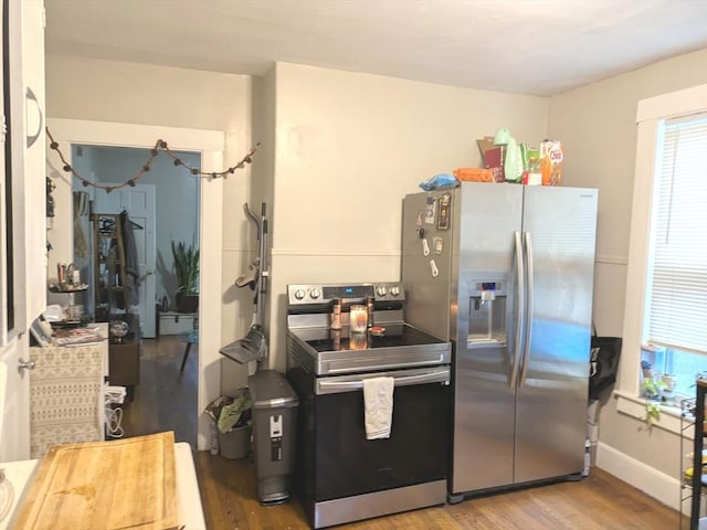 12-14 Essex St, Dover, NH 03820 - kitchen with stainless steel appliances, wood finished floors, and baseboards