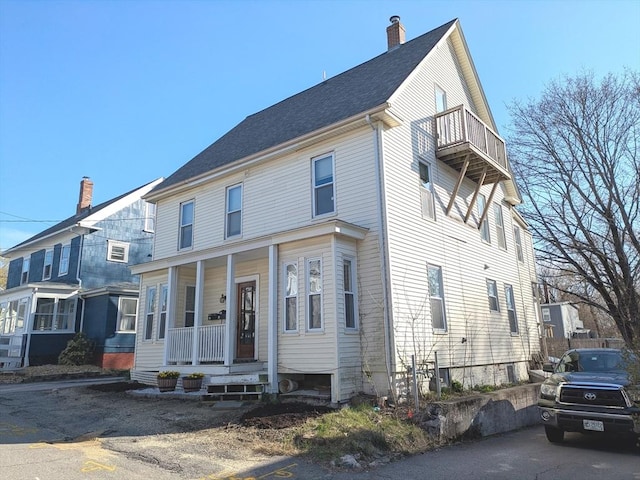 12-14 Essex St, Dover, NH 03820 - view of front of home with a porch, a balcony, and a chimney