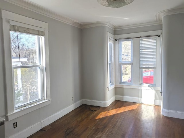 12-14 Essex St, Dover, NH 03820 - unfurnished room with plenty of natural light, baseboards, hardwood / wood-style floors, and crown molding