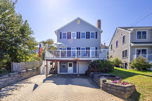 38 Point Allerton Ave, Hull, MA 02045 - rear view of house with a chimney, stairway, a wooden deck, a patio, and a lawn