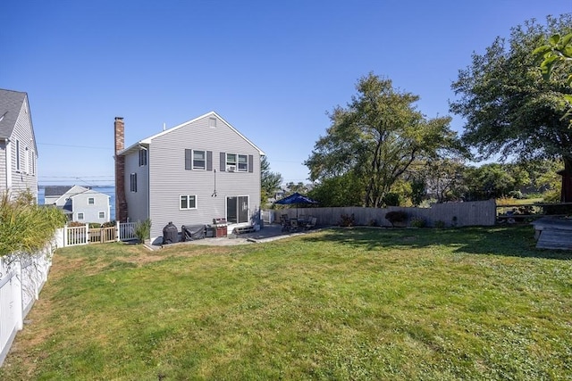 38 Point Allerton Ave, Hull, MA 02045 - back of house featuring a chimney and a patio