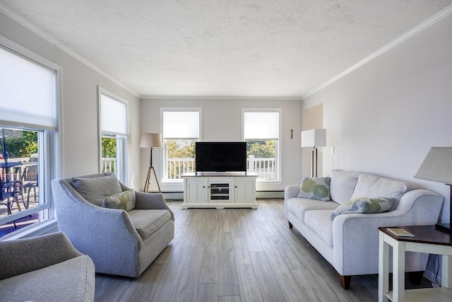 38 Point Allerton Ave, Hull, MA 02045 - living area featuring light wood-style flooring, a baseboard heating unit, ornamental molding, and a textured ceiling