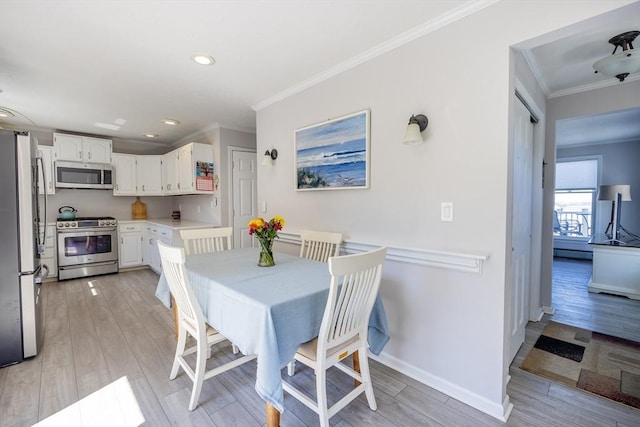 38 Point Allerton Ave, Hull, MA 02045 - dining space with ornamental molding, light wood-type flooring, baseboards, and recessed lighting