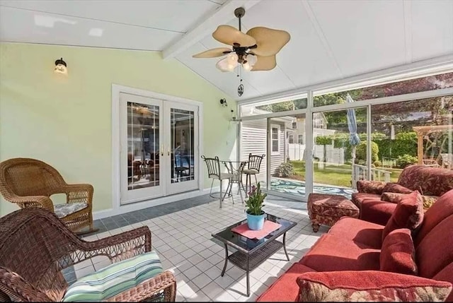 sunroom with lofted ceiling with beams, french doors, and ceiling fan