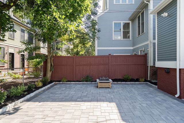 view of patio / terrace featuring a fire pit