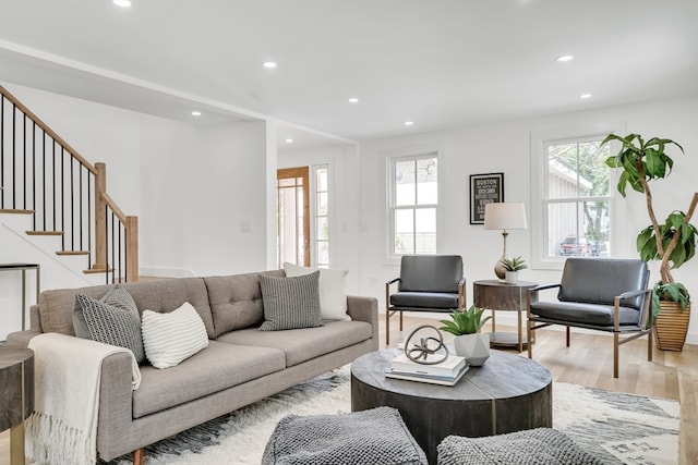 living room featuring a wealth of natural light and light wood-type flooring