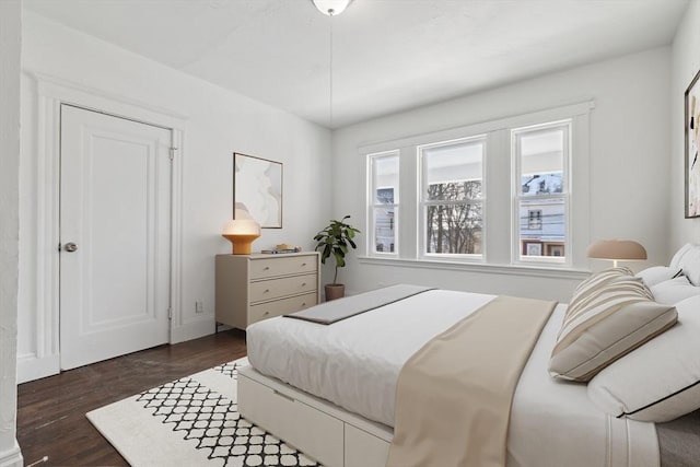 bedroom featuring dark hardwood / wood-style flooring