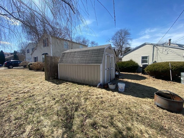 exterior space with an outdoor structure and a shed