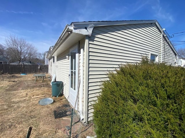 view of side of property with fence