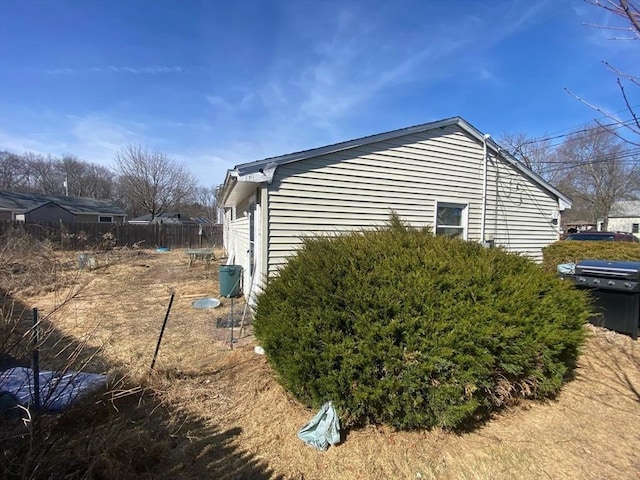 view of property exterior with fence