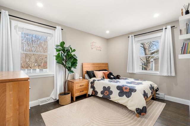 bedroom featuring dark wood finished floors, visible vents, recessed lighting, and baseboards