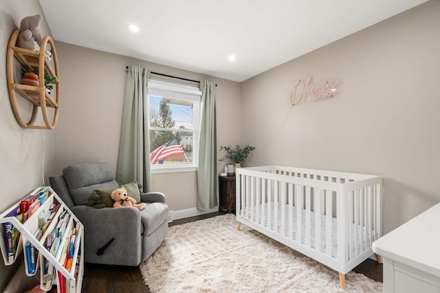 bedroom with recessed lighting, baseboards, and wood finished floors