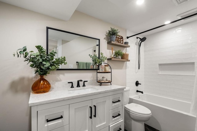 bathroom with visible vents, toilet, vanity, and bathing tub / shower combination