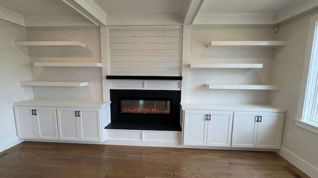 7 Avery St, Needham, MA 02494 - detailed view of crown molding, a glass covered fireplace, wood finished floors, and baseboards