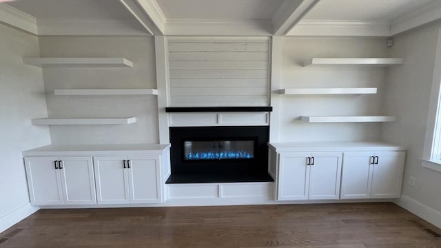 7 Avery St, Needham, MA 02494 - detailed view of crown molding, wood finished floors, baseboards, and a glass covered fireplace