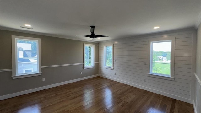 7 Avery St, Needham, MA 02494 - empty room with plenty of natural light, dark wood-type flooring, baseboards, ornamental molding, and ceiling fan