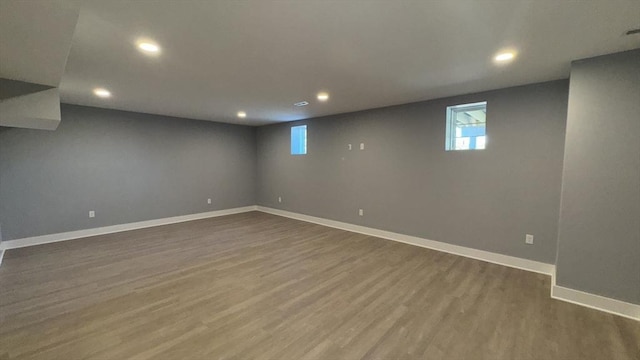 7 Avery St, Needham, MA 02494 - basement with recessed lighting, dark wood finished floors, baseboards, and healthy amount of natural light