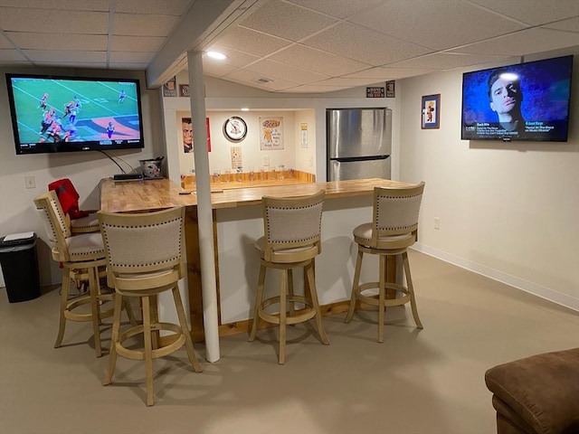 38 Bay Pointe Dr Unit 38, Wareham, MA 02532 - indoor bar with freestanding refrigerator, a drop ceiling, and finished concrete flooring