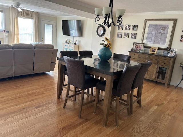 38 Bay Pointe Dr Unit 38, Wareham, MA 02532 - dining room featuring light wood-style floors, a chandelier, crown molding, and ceiling fan