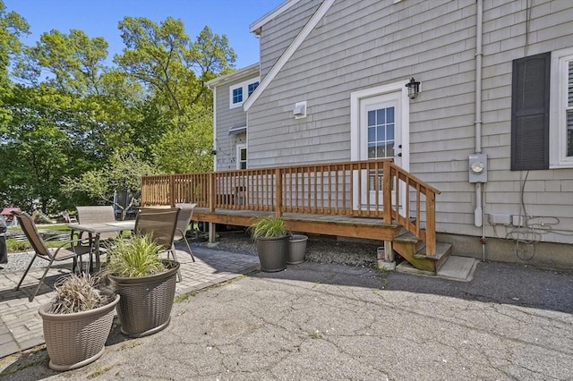 view of patio / terrace with outdoor dining space and a wooden deck