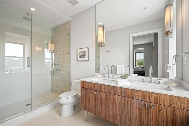 bathroom featuring a sink, visible vents, and a shower stall