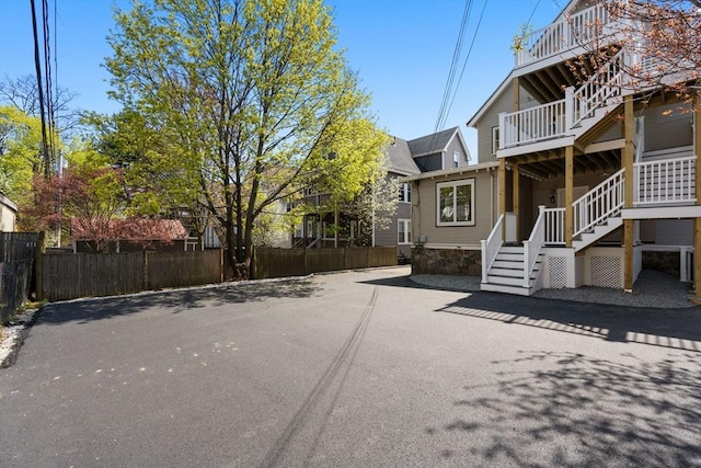 exterior space featuring stairs and driveway