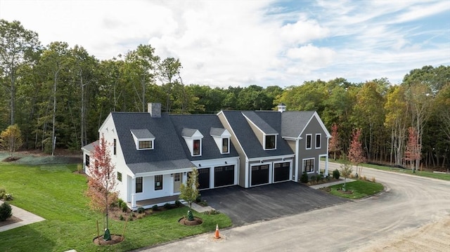 view of front of house featuring a garage and a front yard