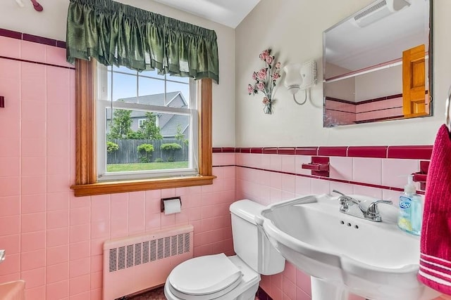 23 Willard St, Dedham, MA 02026 - bathroom featuring radiator, tile walls, and a wainscoted wall
