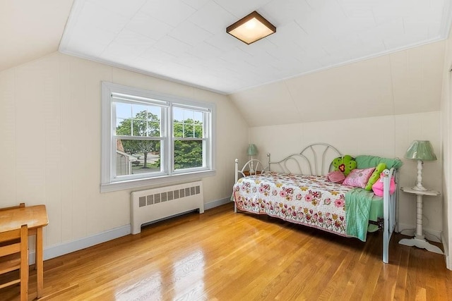 23 Willard St, Dedham, MA 02026 - bedroom featuring radiator, wood finished floors, and lofted ceiling