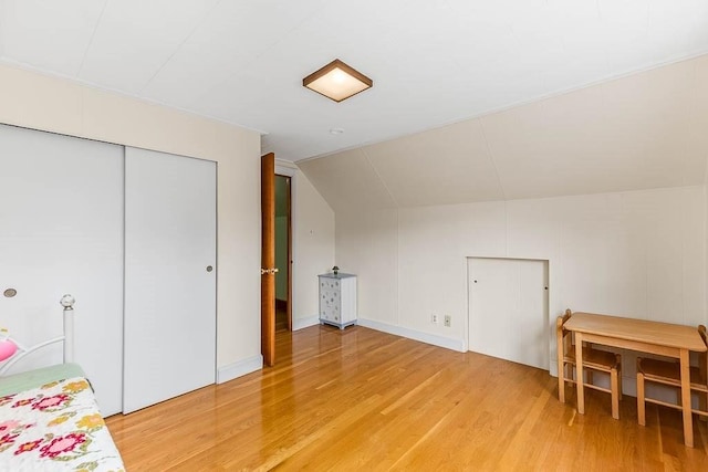 23 Willard St, Dedham, MA 02026 - bonus room featuring light wood-type flooring and vaulted ceiling