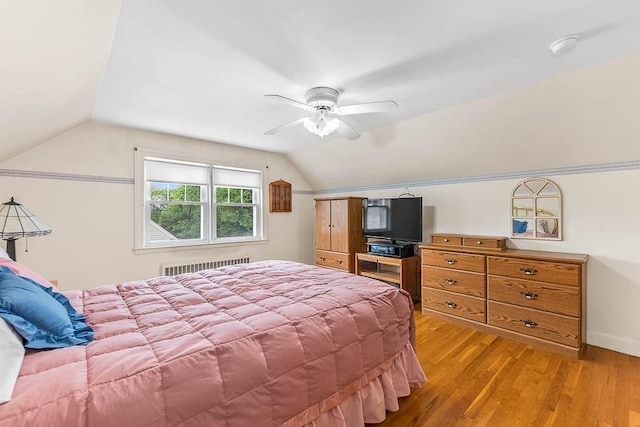 23 Willard St, Dedham, MA 02026 - bedroom featuring radiator heating unit, lofted ceiling, light wood-type flooring, and a ceiling fan