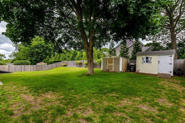 23 Willard St, Dedham, MA 02026 - fenced backyard featuring a storage unit