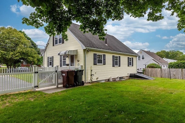 23 Willard St, Dedham, MA 02026 - back of house with a gate and a shingled roof