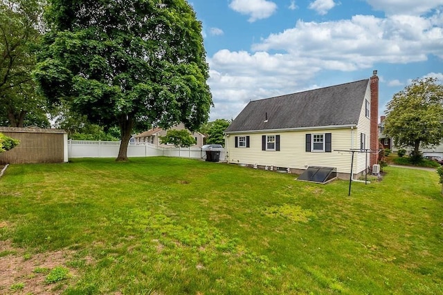 23 Willard St, Dedham, MA 02026 - rear view of house with a chimney